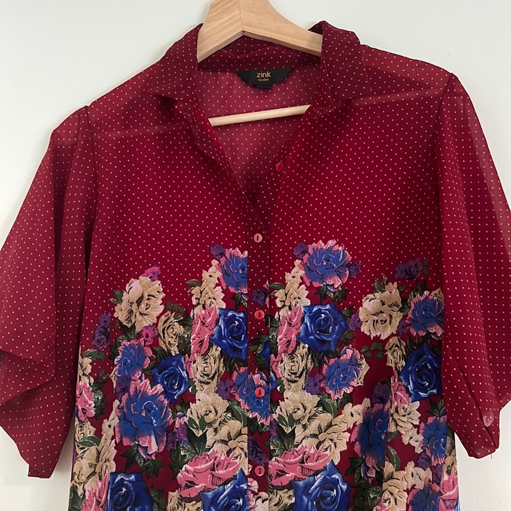 Red color sheer shirt with flower patterns and wide sleeves